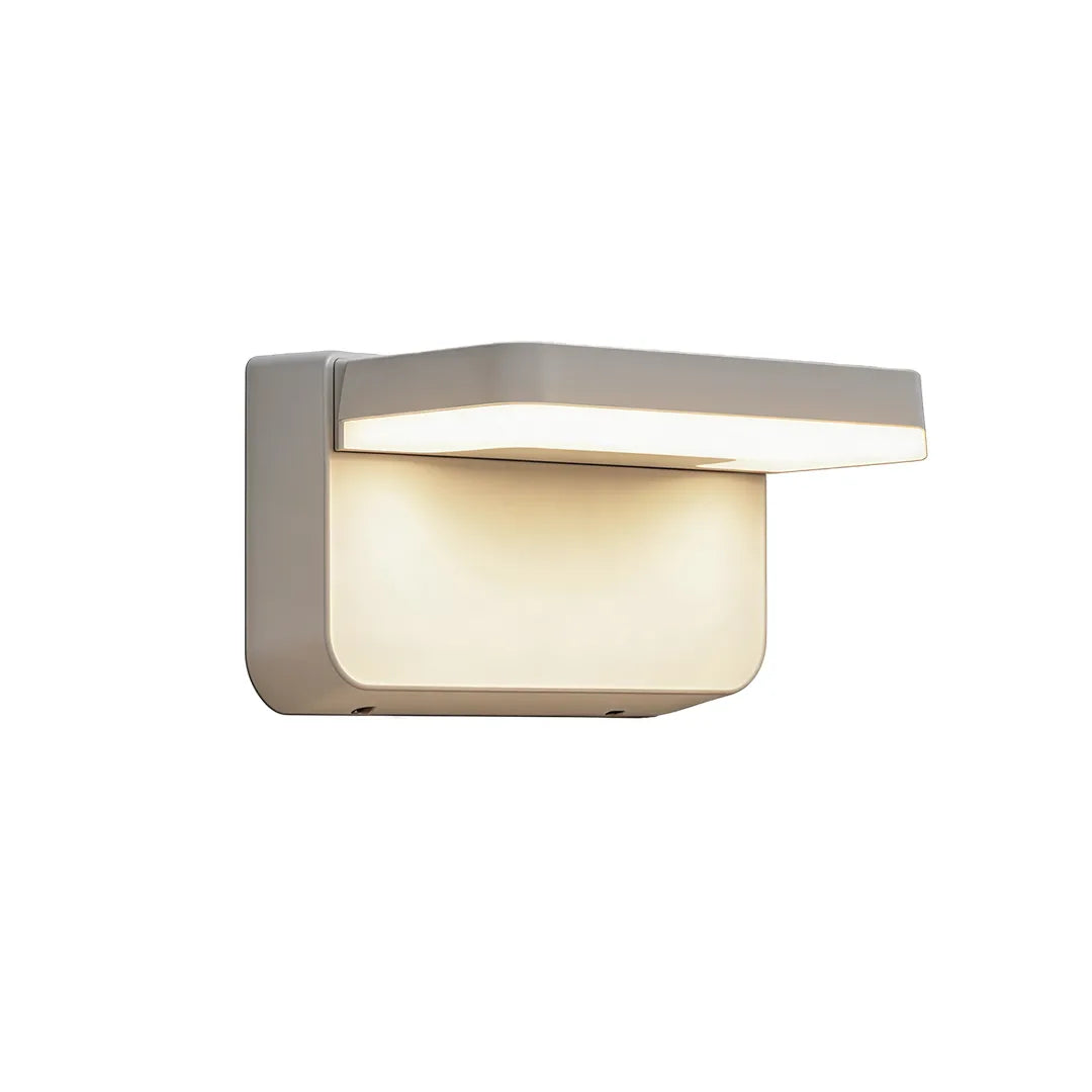 Short modern outdoor wall light with silver frame and warm LED lighting