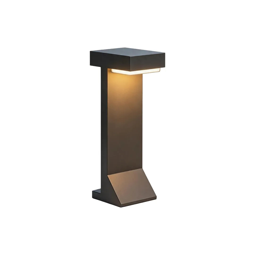 Short modern solar bollard light with black frame and warm LED lighting