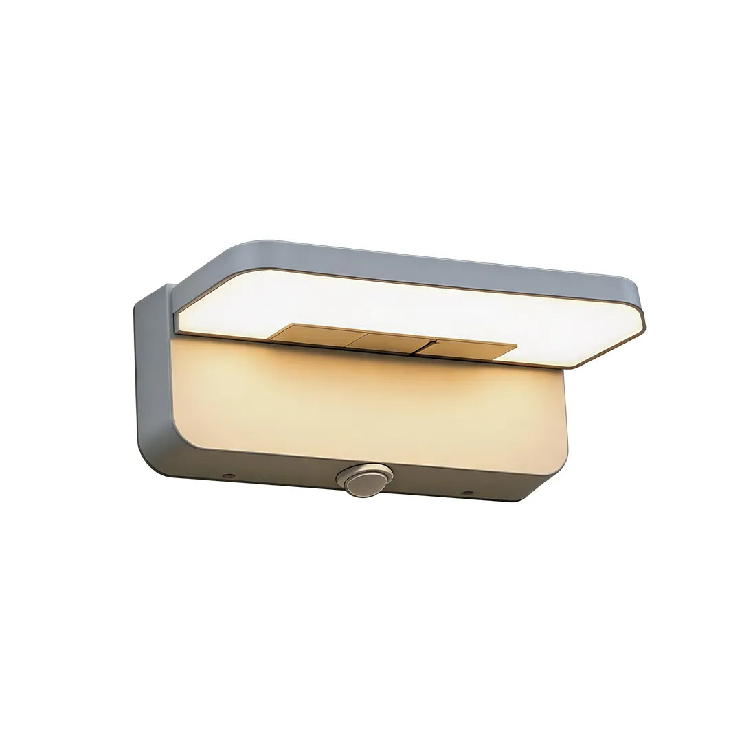 Short silver outdoor wall light with motion sensor and warm LED lighting