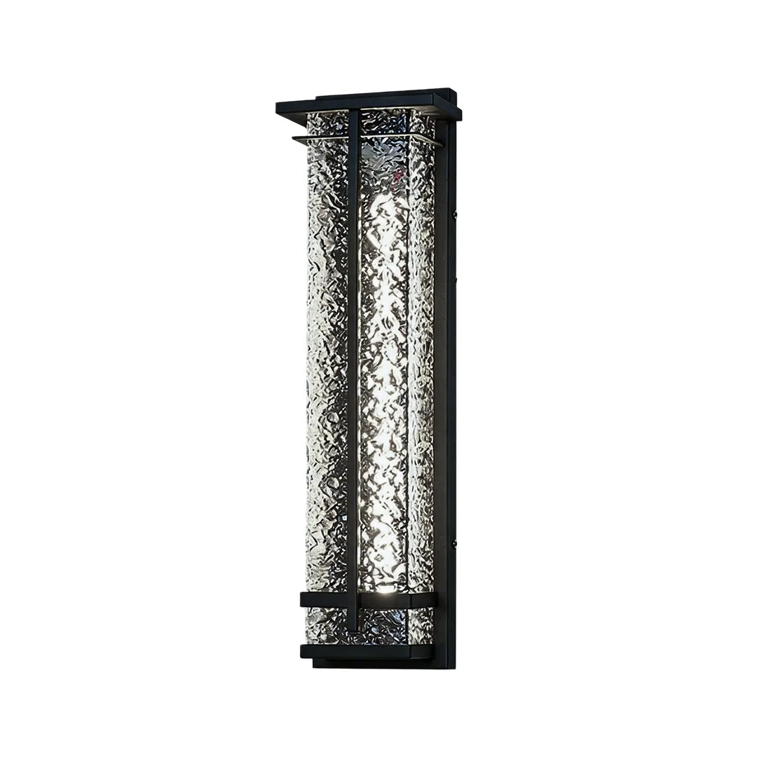Short outdoor wall sconce with textured glass shade and black metal housing