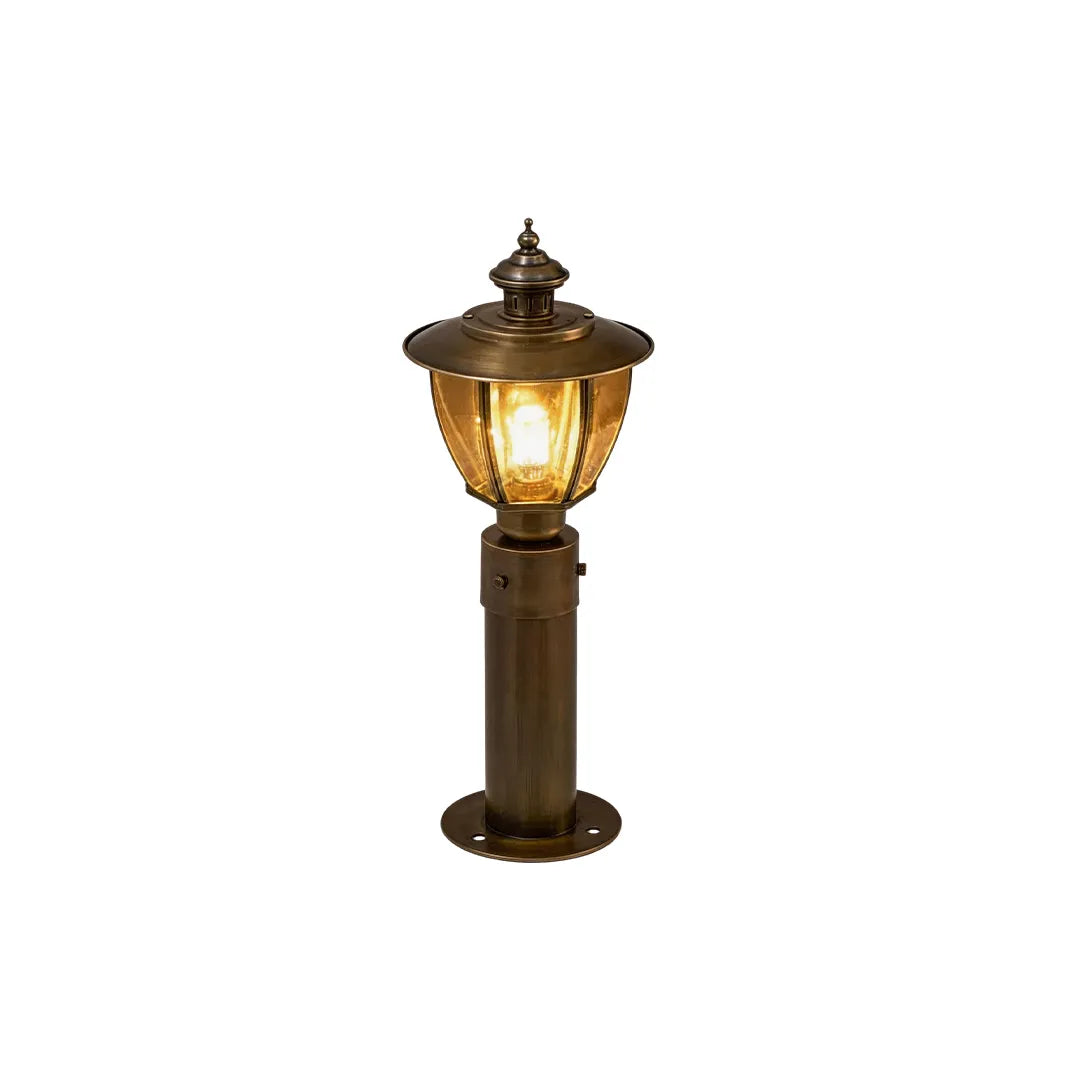 Short vintage brass bollard light with classic lantern top and warm illumination