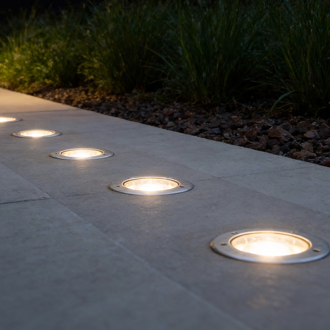 Side angle of recessed floor lighting highlighting LED bulb and solar panel for modern outdoor spaces.