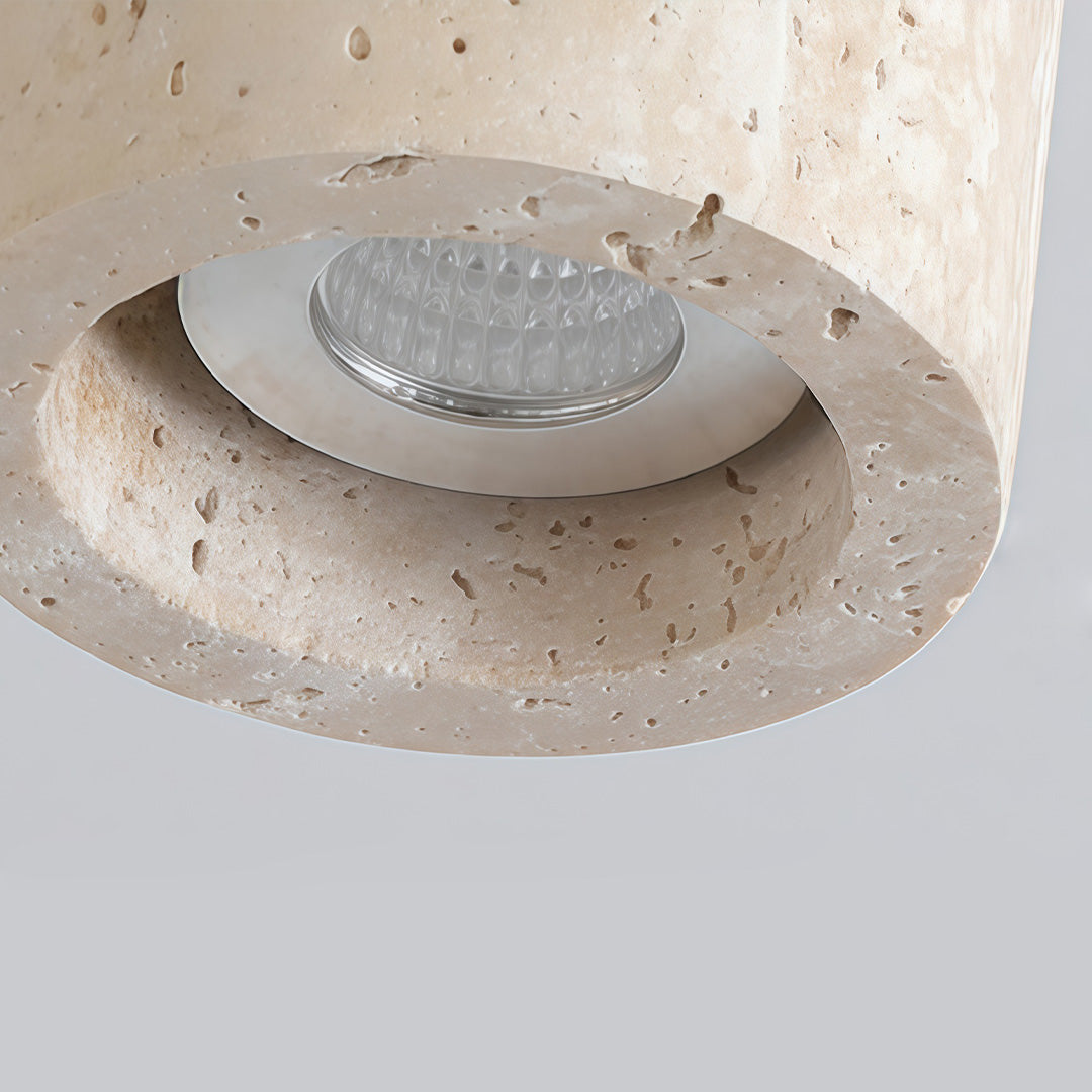 Side profile of a cylinder downlight, highlighting its minimalist form and warm glow.