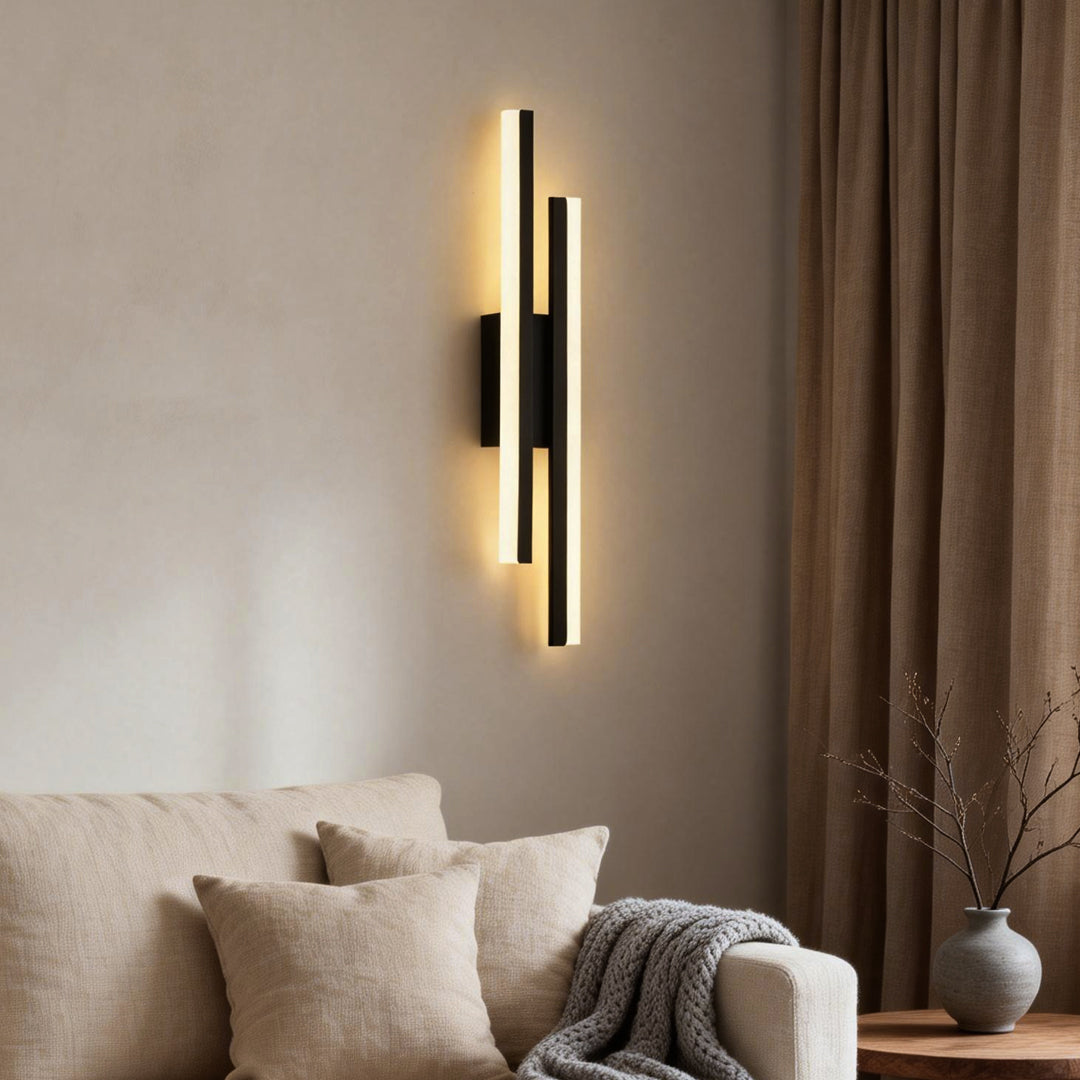 Modern and sleek side vanity light for bathroom with a black and gold finish, providing soft and ambient illumination.