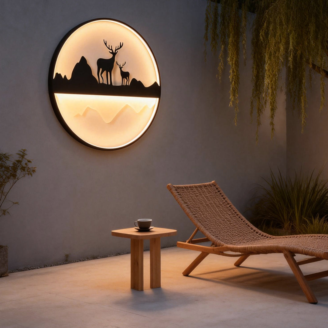Silhouette wall light providing warm glow beside a lounge chair.