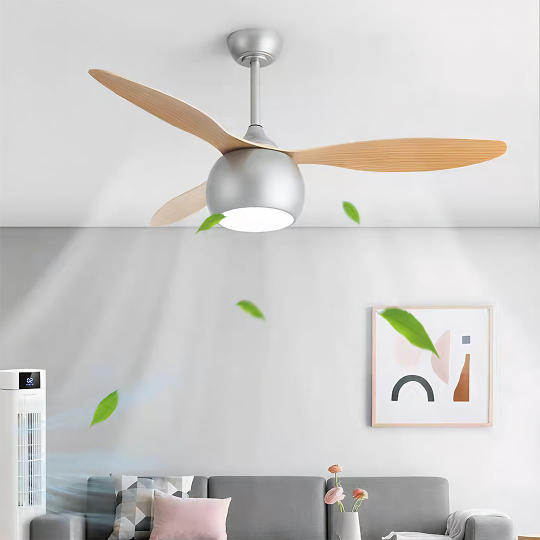 Silver ceiling fan with light mounted in minimalist white bedroom with botanical artwork and pink accents