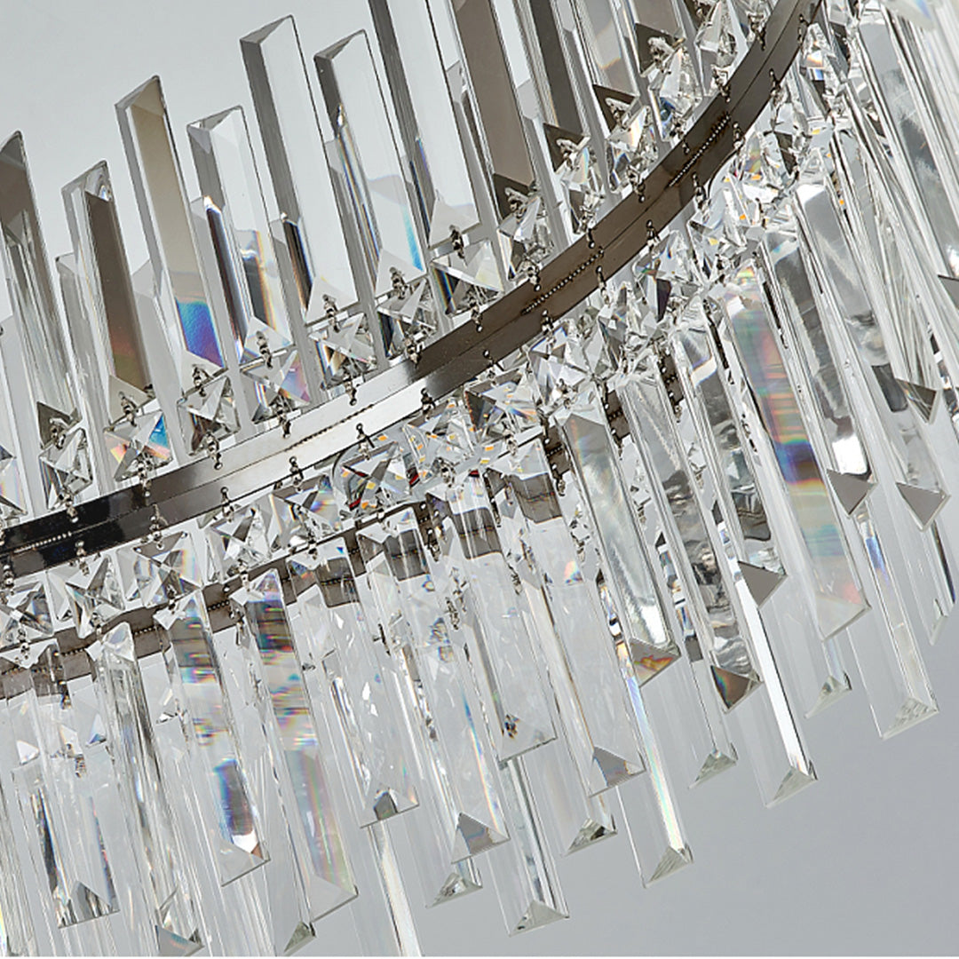 Crystal ceiling light prism detail revealing hanging crystal elements and chrome hardware