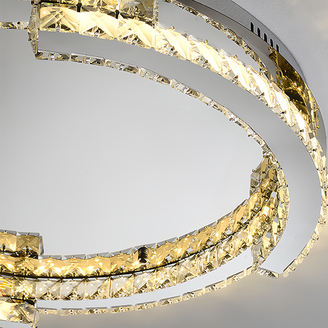 Close-up detail of silver flush mount ceiling light showing crystal and chrome finish construction