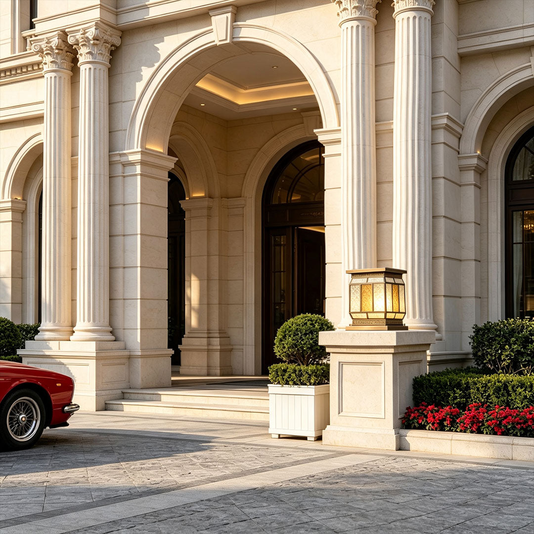 Silver wall lights mounted beside a dark stone bathroom mirror with elegant warm ambient lighting.