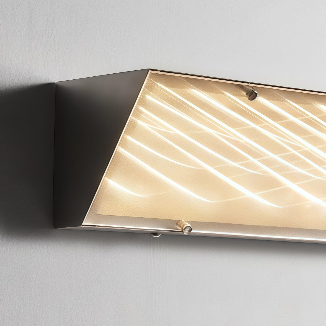 Detailed side view of modern silver wall lights mounted on a dark wall with soft warm ambient glow.