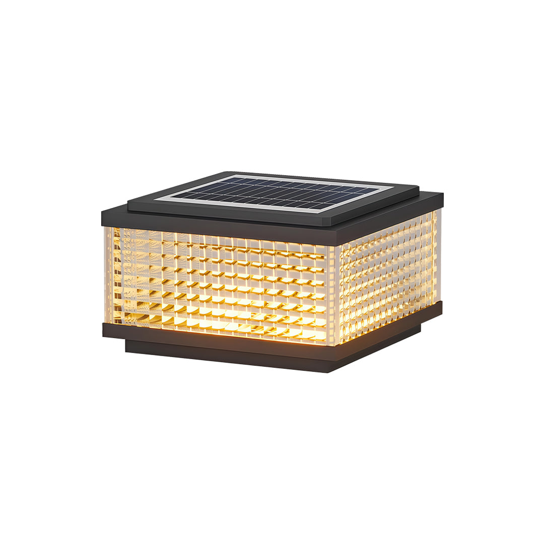 Close-up of large outdoor solar pillar lights highlighting illuminated textured diffuser and modern frame design.