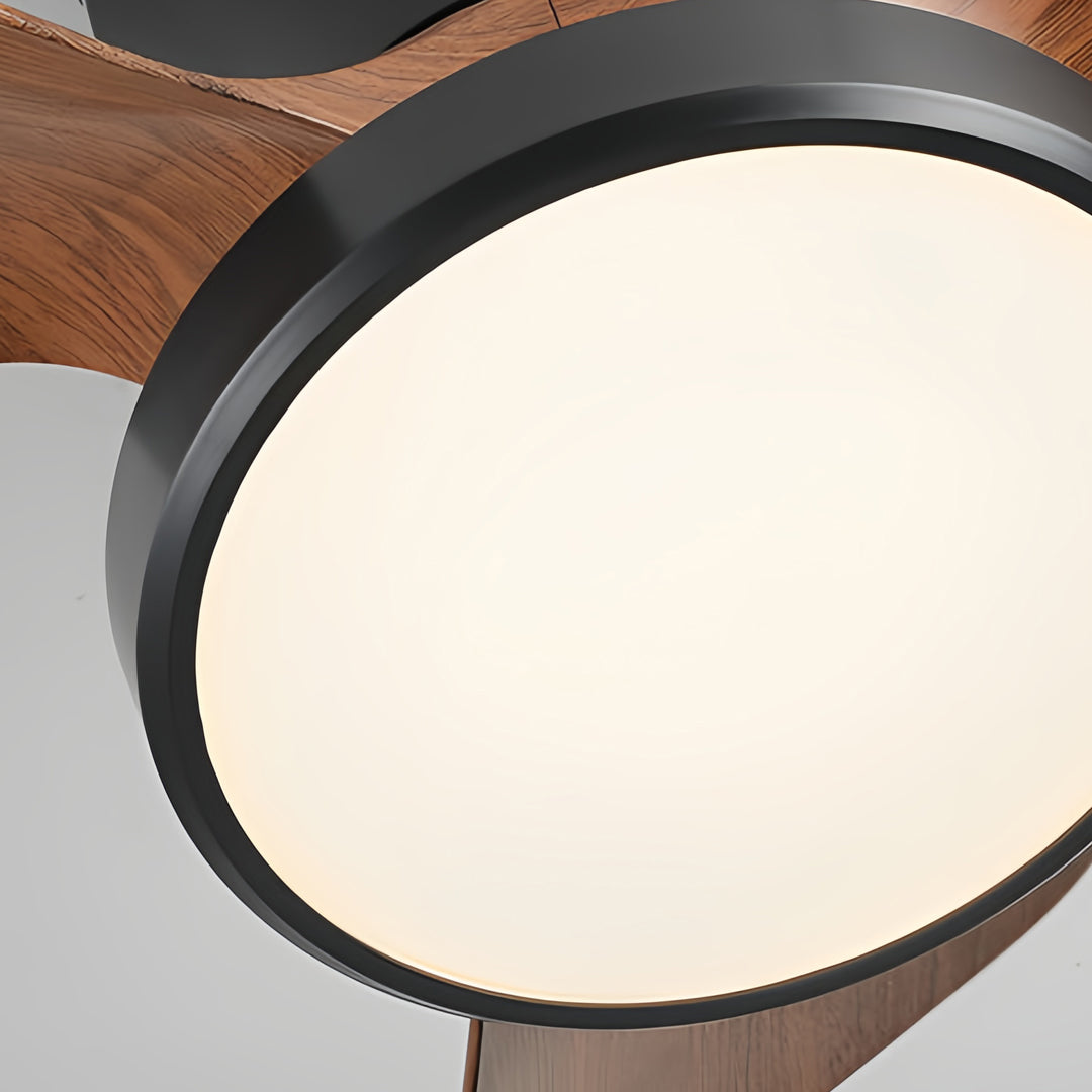 Simple white ceiling fan with light paired with darker wood blades, adding a modern touch to a cozy sleeping space.