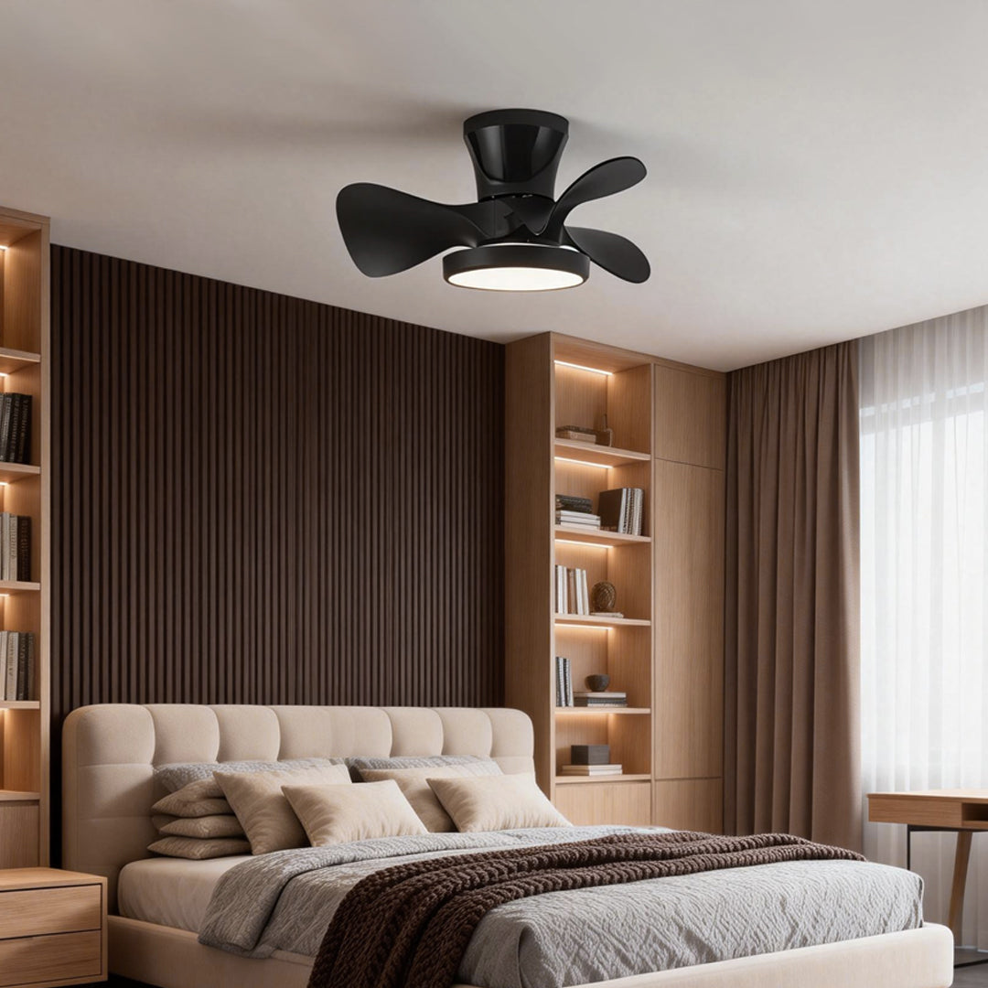 Simple white ceiling fan with light installed in a modern bedroom, providing soft ambient lighting and a clean minimalist look.