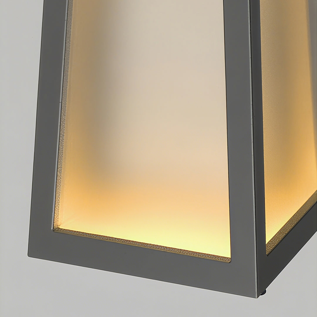 Single camping lantern fixture, showcasing the black metal frame and the bright, trapezoidal light output.