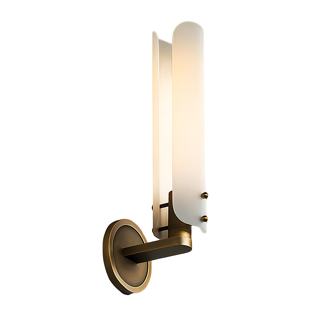 Single brass wall light with glass shade mounted on white background showing warm LED glow.