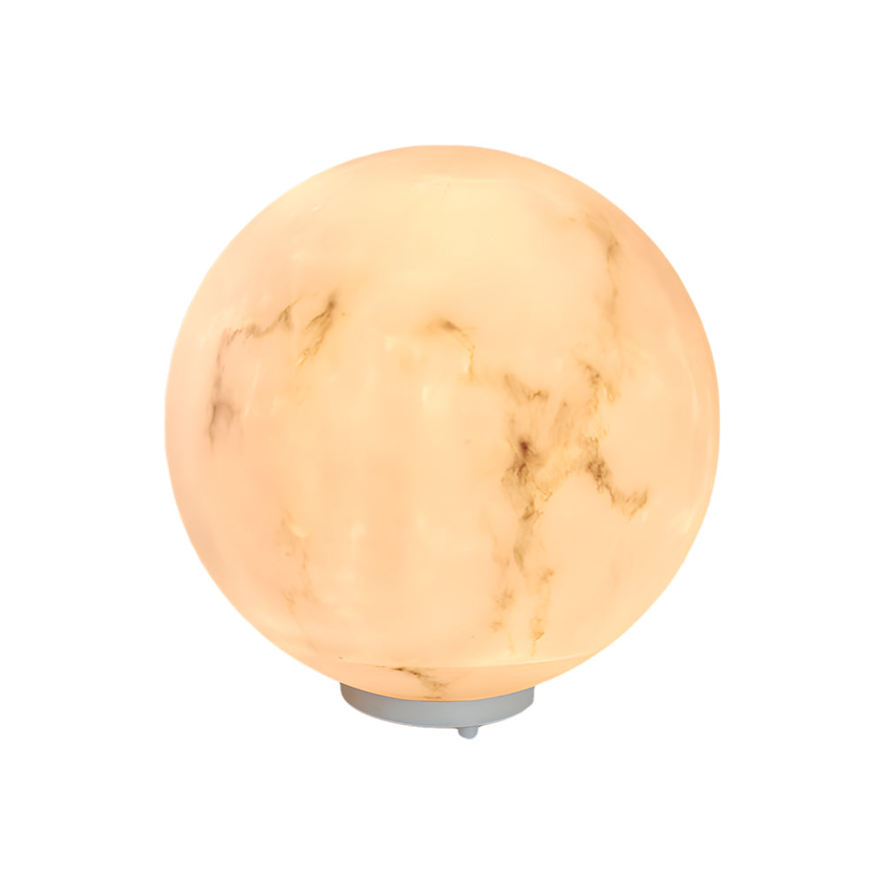 Single outdoor pillar lights with a marble pattern, standing alone on a stone base for garden decor.