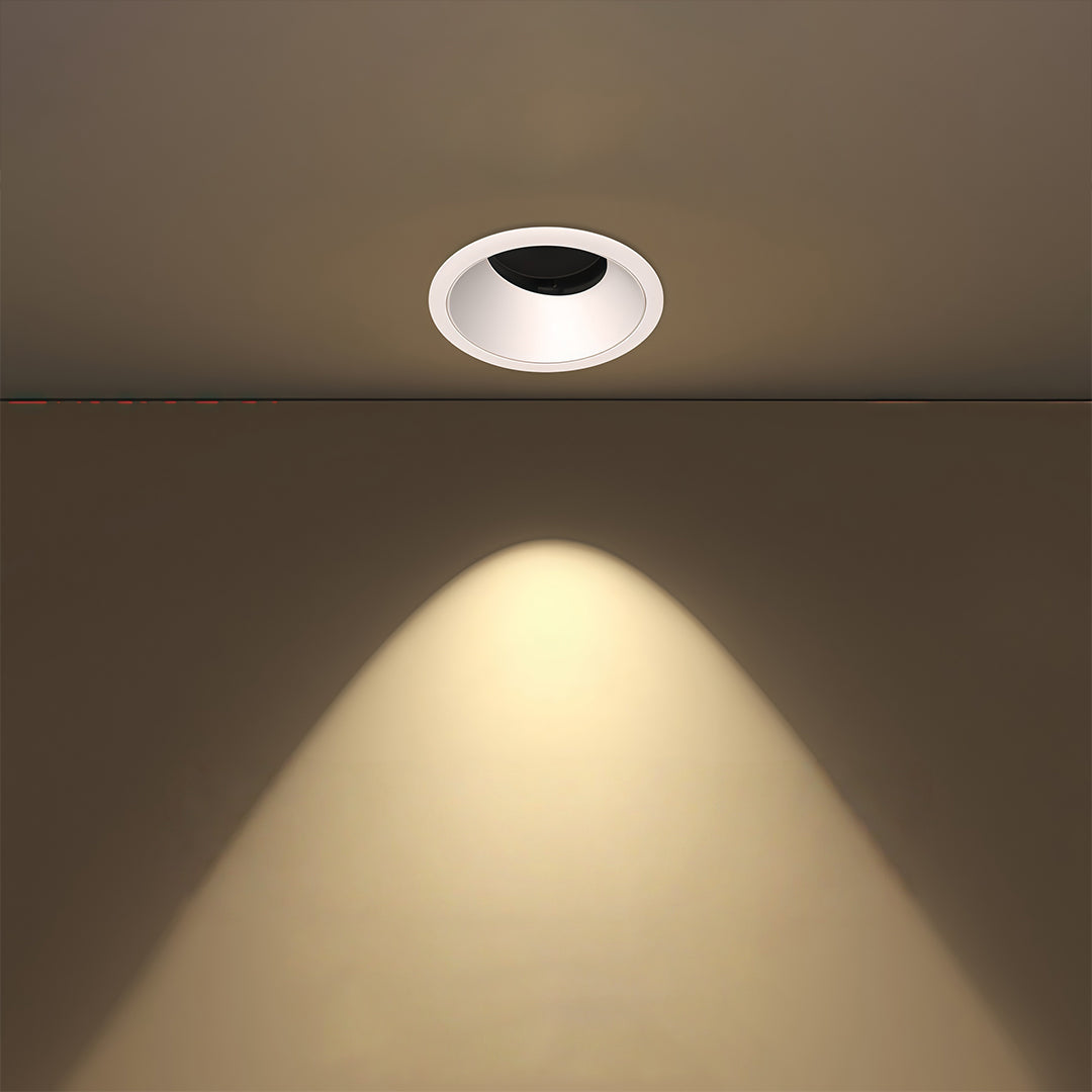 Single spotlight for house demonstrating focused downlight with warm beam on neutral ceiling