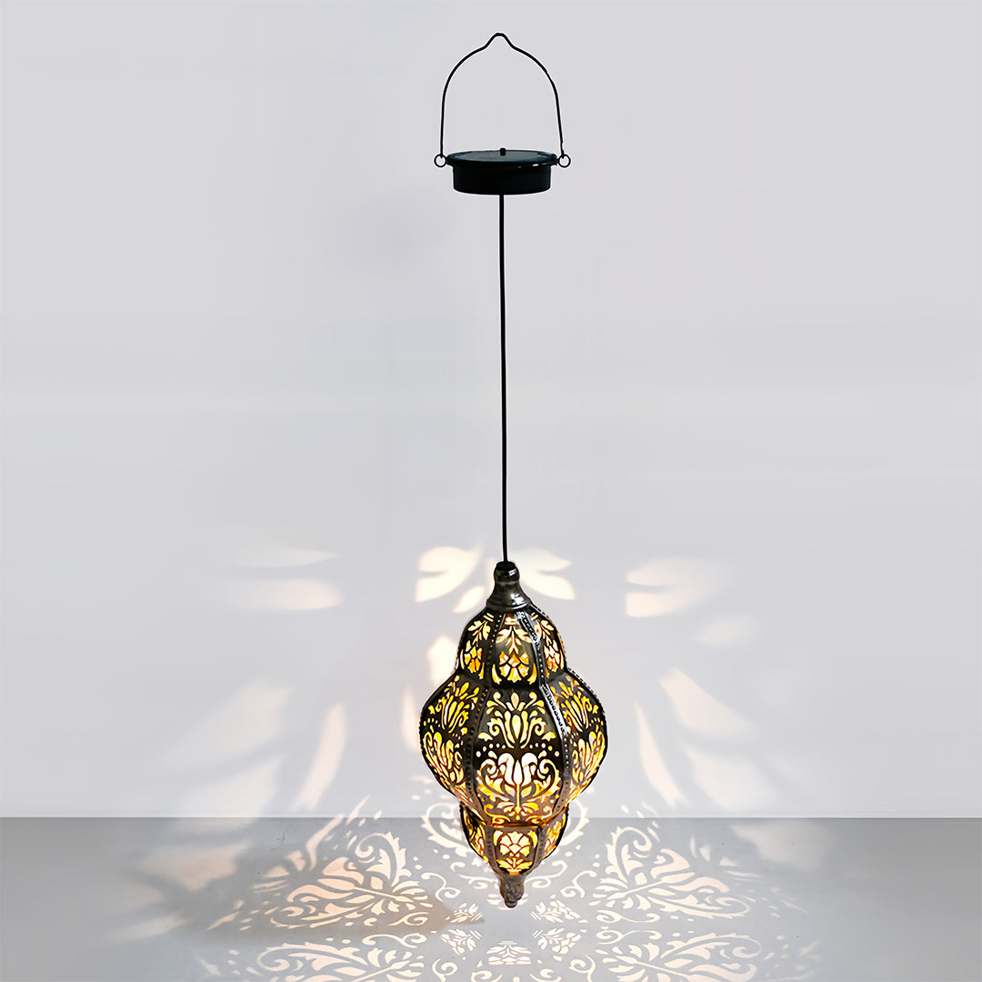 Single teardrop-shaped outdoor moroccan lanterns with exotic shadow casting on a neutral background for display.