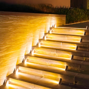Single outdoor solar step lights with triangular profile perfect for individual stair tread installation