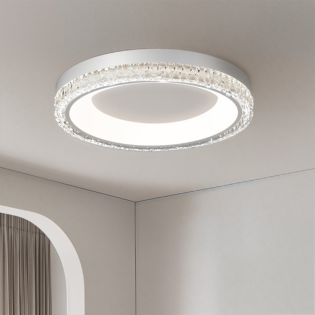 Single white flush mount ceiling light on a recessed ceiling, providing bright, non-glare lighting for a large living space.