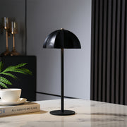Sleek black iron table lamps creating dramatic lighting in modern workspace environment