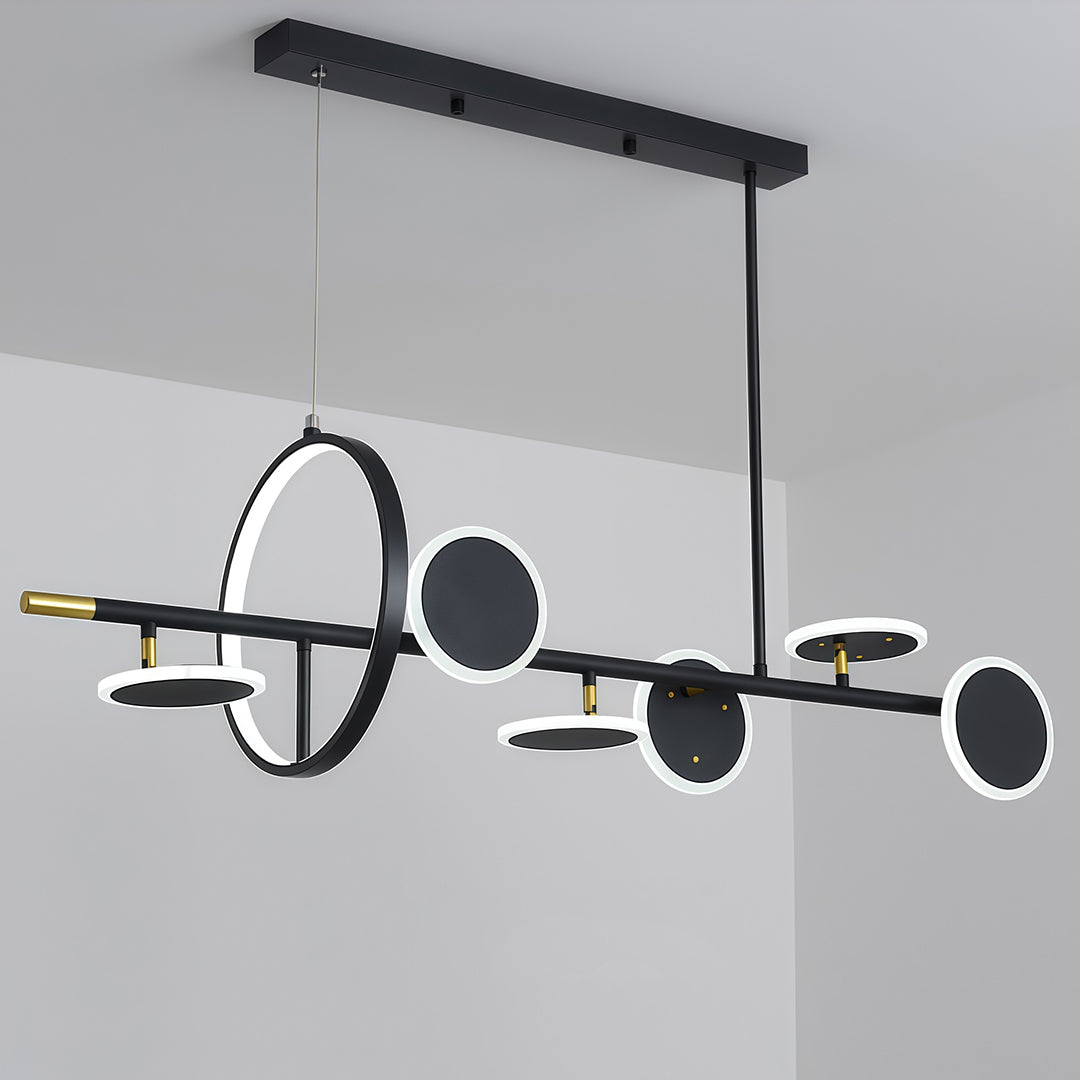 Full view of a sleek black linear 6 light chandelier with geometric ring and disc elements, suspended from a rectangular canopy.