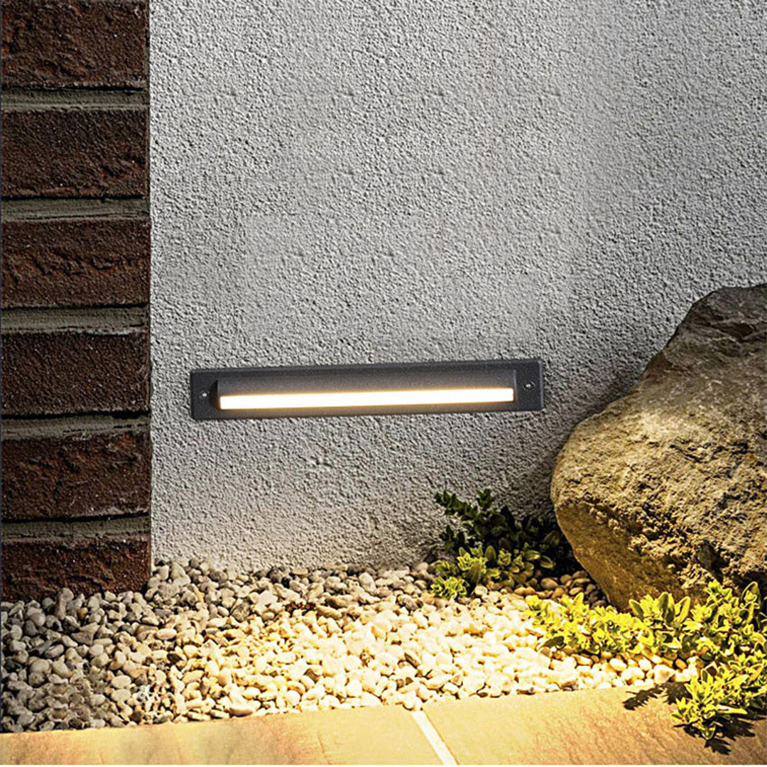 Sleek black rectangular linear light with smooth front panel and contemporary design