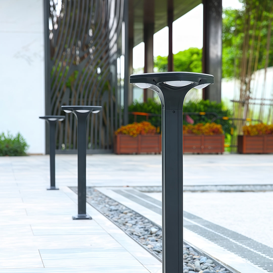 Sleek black outdoor wall light with solar panel integrated into the design, ideal for garden lighting.