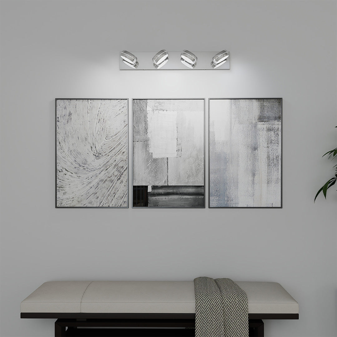Sleek chrome bathroom vanity light with glass shade chandelier design illuminating minimalist gray concrete bathroom space.