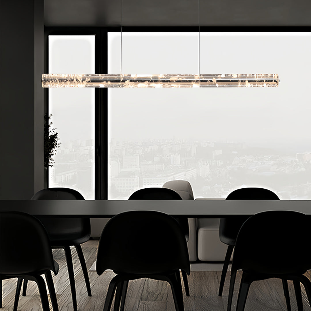 Sleek crystal light pendants hanging above a conference table, adding elegance to a minimalist meeting room.