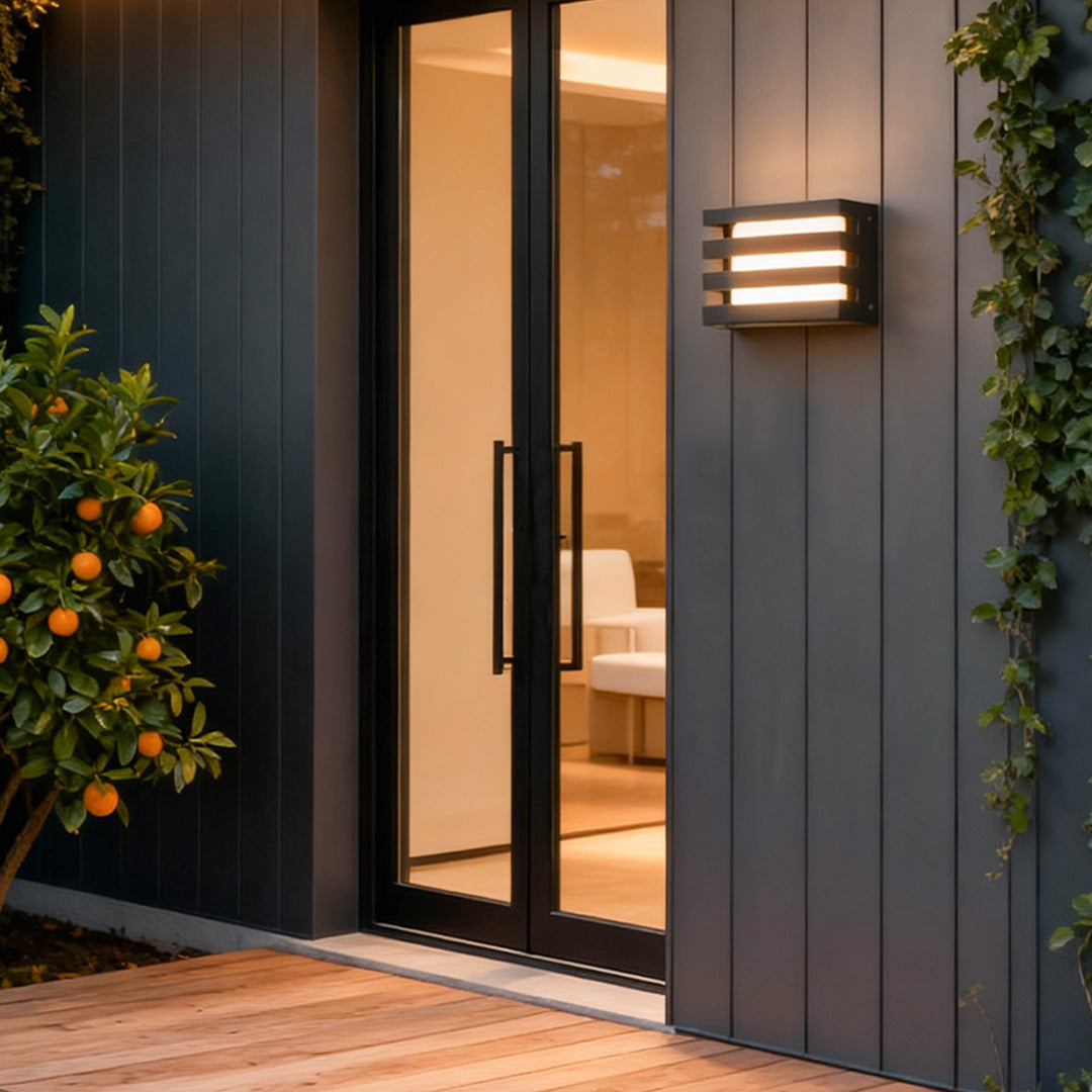 Sleek outdoor wall lights LED installed near a contemporary doorway, providing soft illumination for the exterior space.