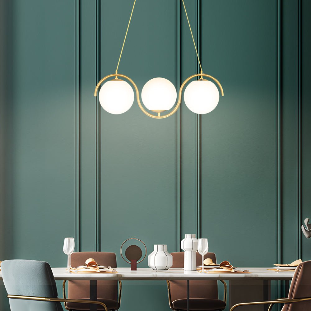 Sleek glass ball linear chandelier with three light orbs, perfect for brightening up your kitchen or dining area.