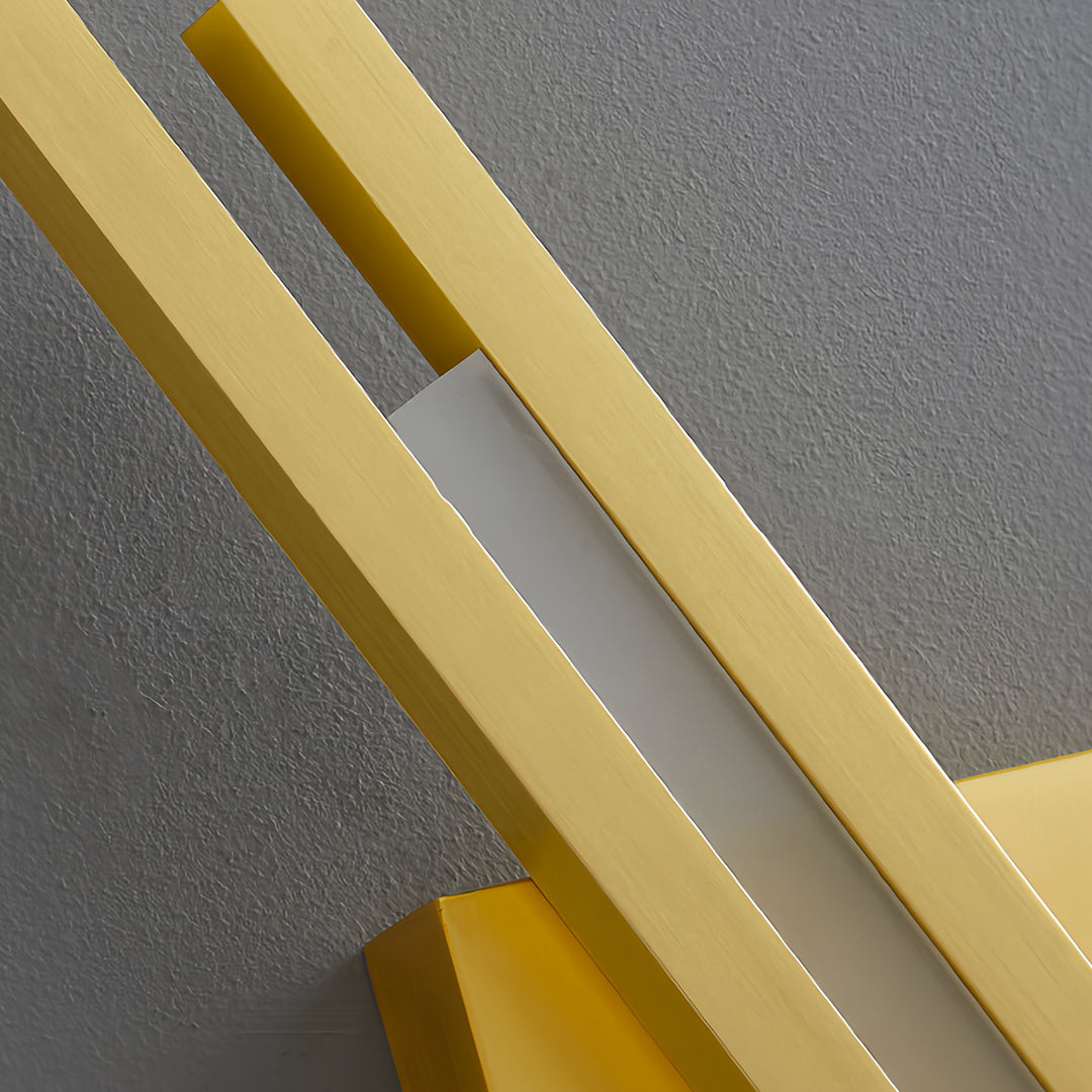 Sleek gold metal floor lamp with a diamond-shaped shade in a modern hallway