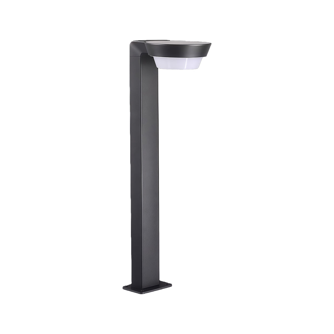Sleek LED path light installed along a garden walkway, offering soft illumination for outdoor spaces.