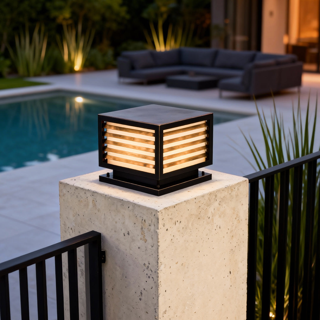 Sleek lights for pillar enhancing the elegance of a stone column beside a modern house.