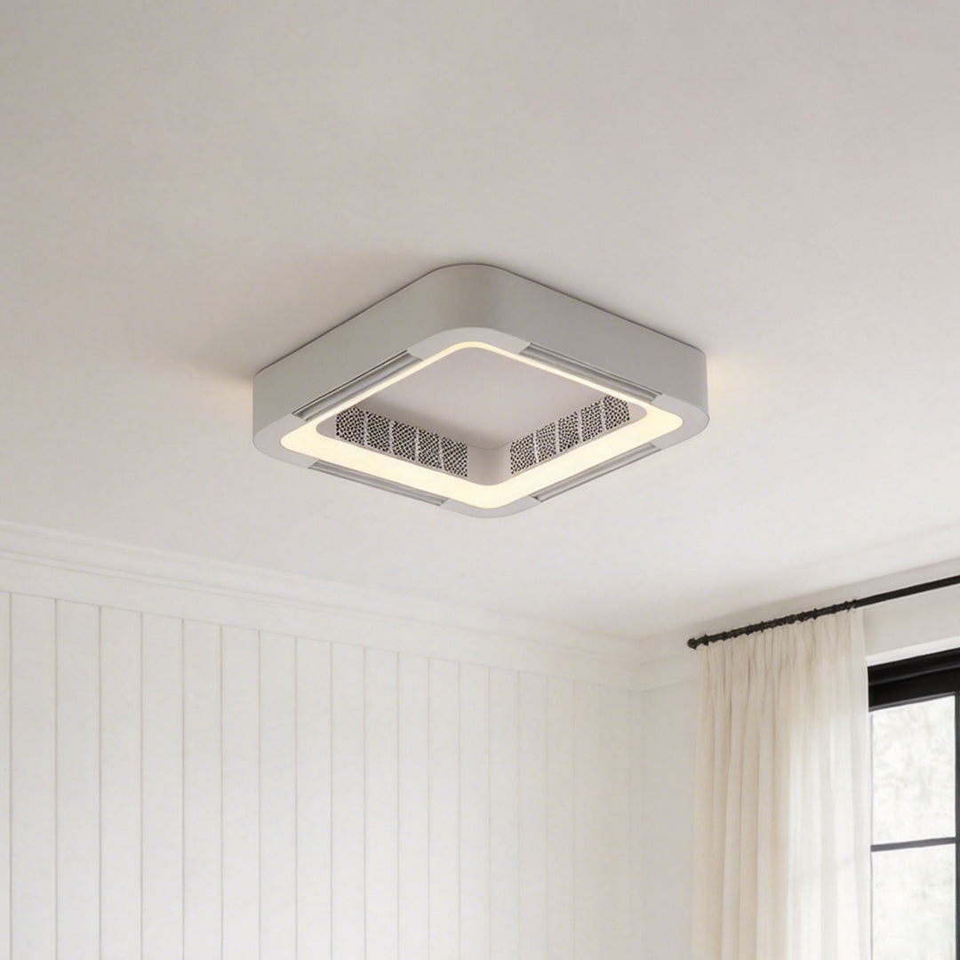 Sleek low profile bladeless ceiling fan with light installed on a white ceiling near a window.