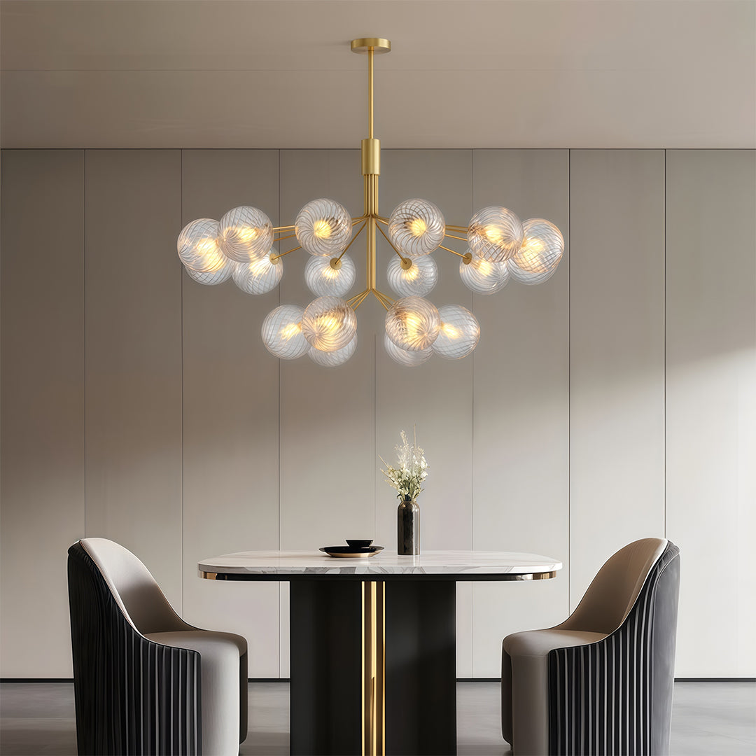 Sleek luxury modern chandeliers featuring glass spheres, adding sophistication to a modern dining area.
