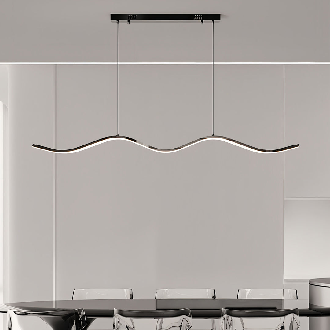 Sleek black kitchen island pendant light emphasizing the smooth, matte finish and the bright light strip embedded in the wave.