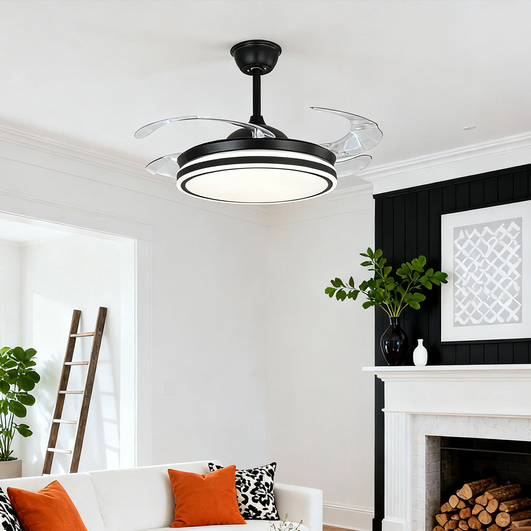 Sleek, modern black ceiling fan with lights installed over a living room fireplace 