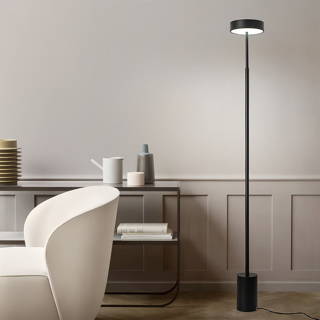 Sleek modern LED petite floor lamp in bright living space offering energy-efficient illumination for everyday use