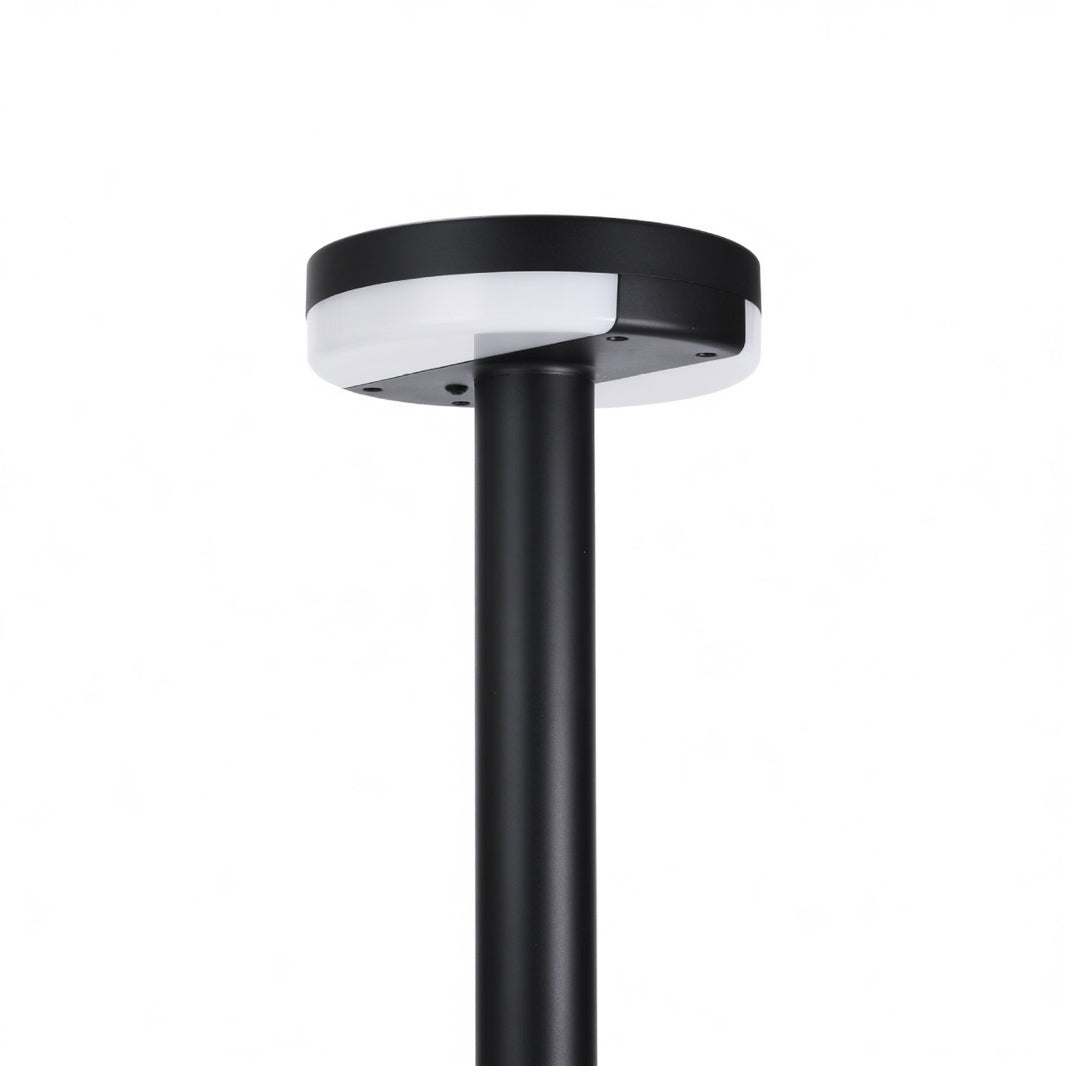 Sleek modern pathway lighting with black circular top and tall straight post in minimalist design