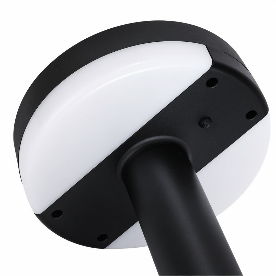 Sleek modern pathway lighting with black circular top and tall straight post in minimalist design