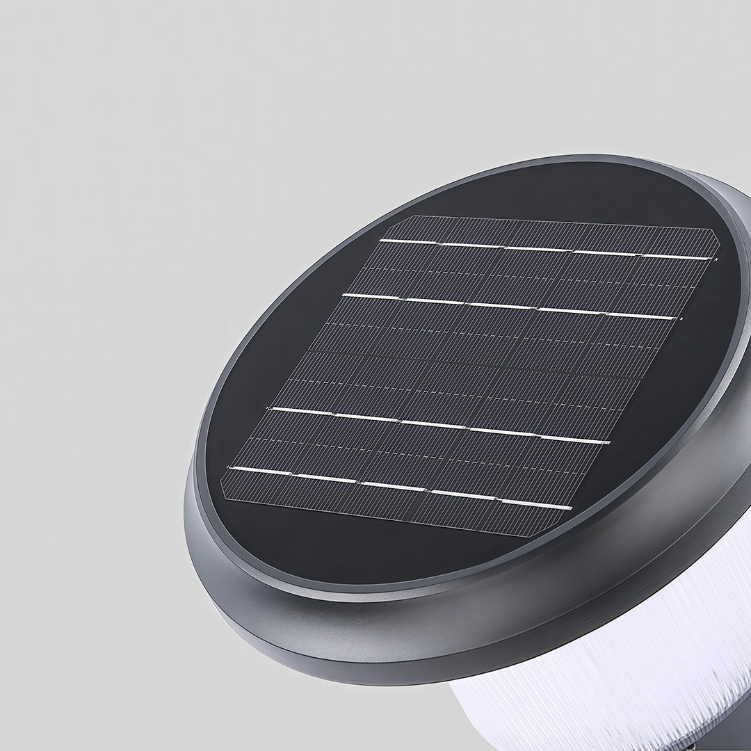 Sleek solar pillar light illuminating a modern stone wall with a contemporary design.