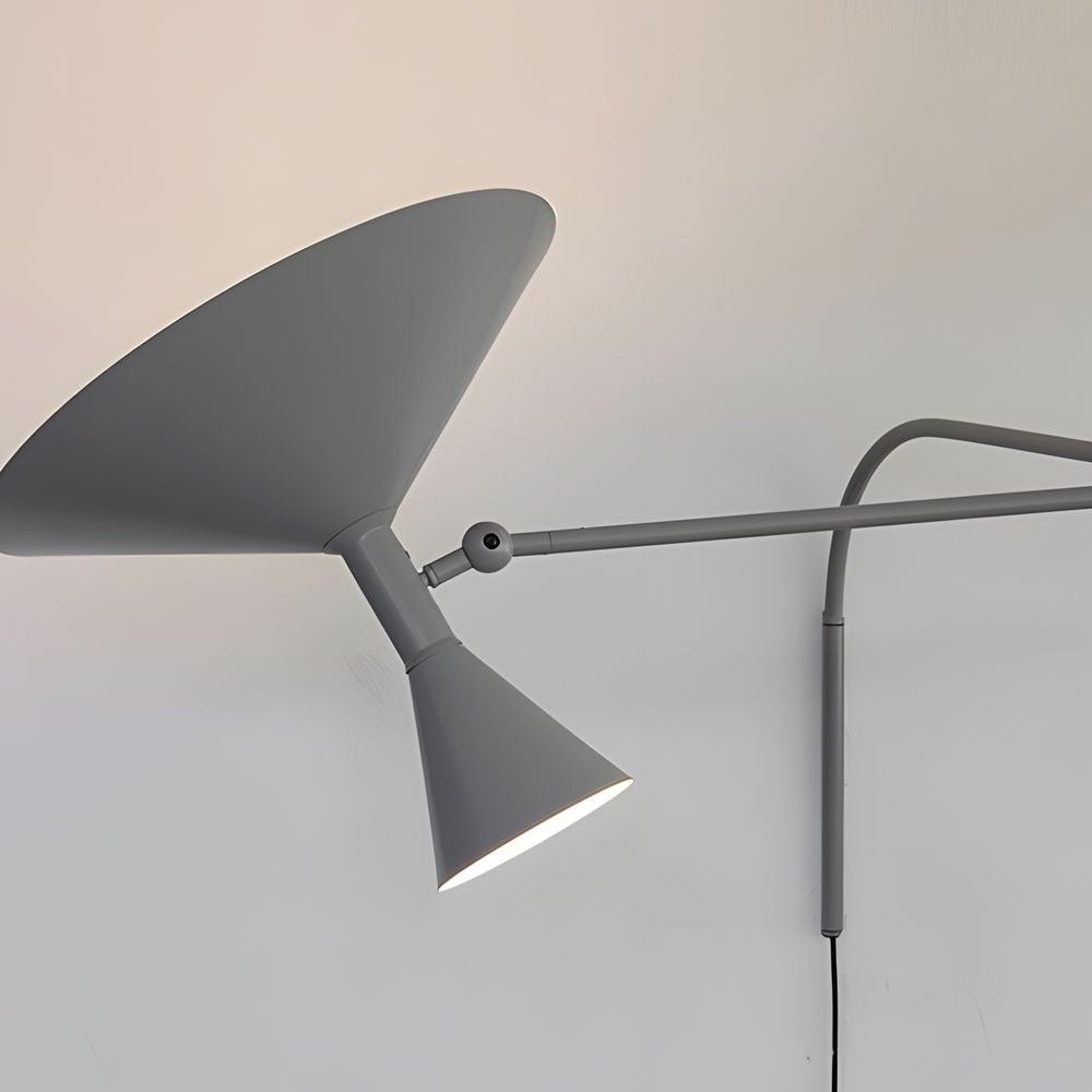 Sleek and sophisticated swing arm wall sconce, featuring modern lines and adjustable light for a dynamic lighting effect.