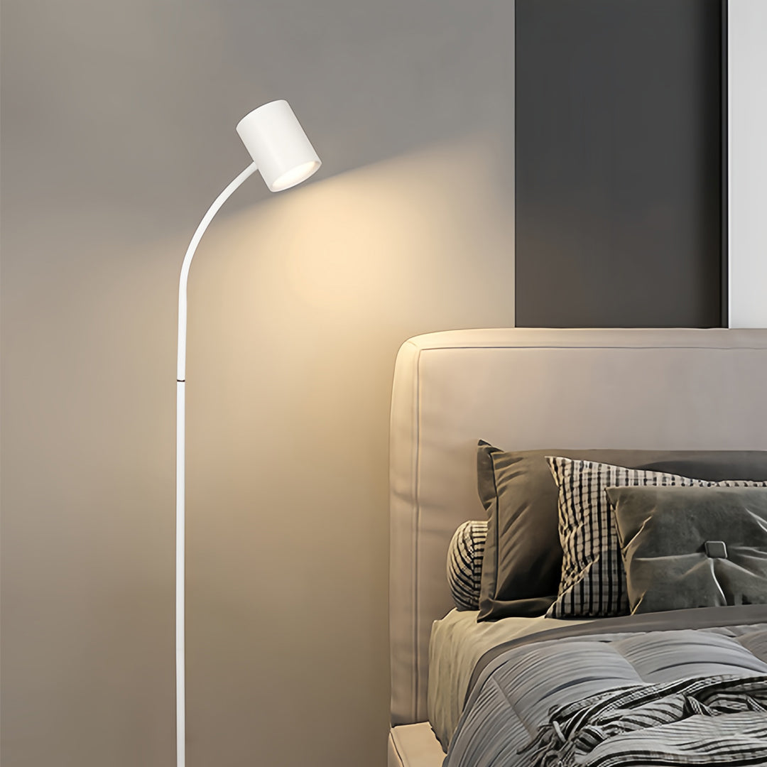 Sleek tall floor lamps illuminating contemporary bedroom with warm ambient glow