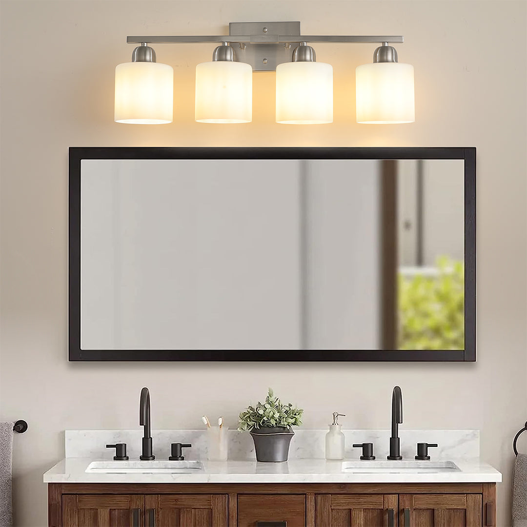 Modern bathroom vanity light with three bulbs, installed above a wooden vanity with a sleek design.