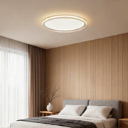 Slim ceiling light installed in a modern bedroom with wood panel wall.