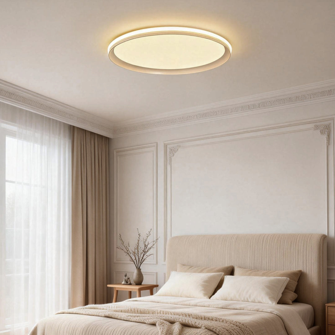 Slim ceiling light installed in a classic bedroom with soft neutral tones.