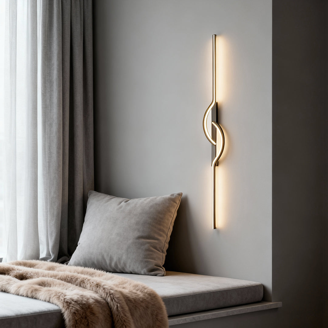 Slim LED modern linear wall sconce with abstract curve detail on a neutral wall.