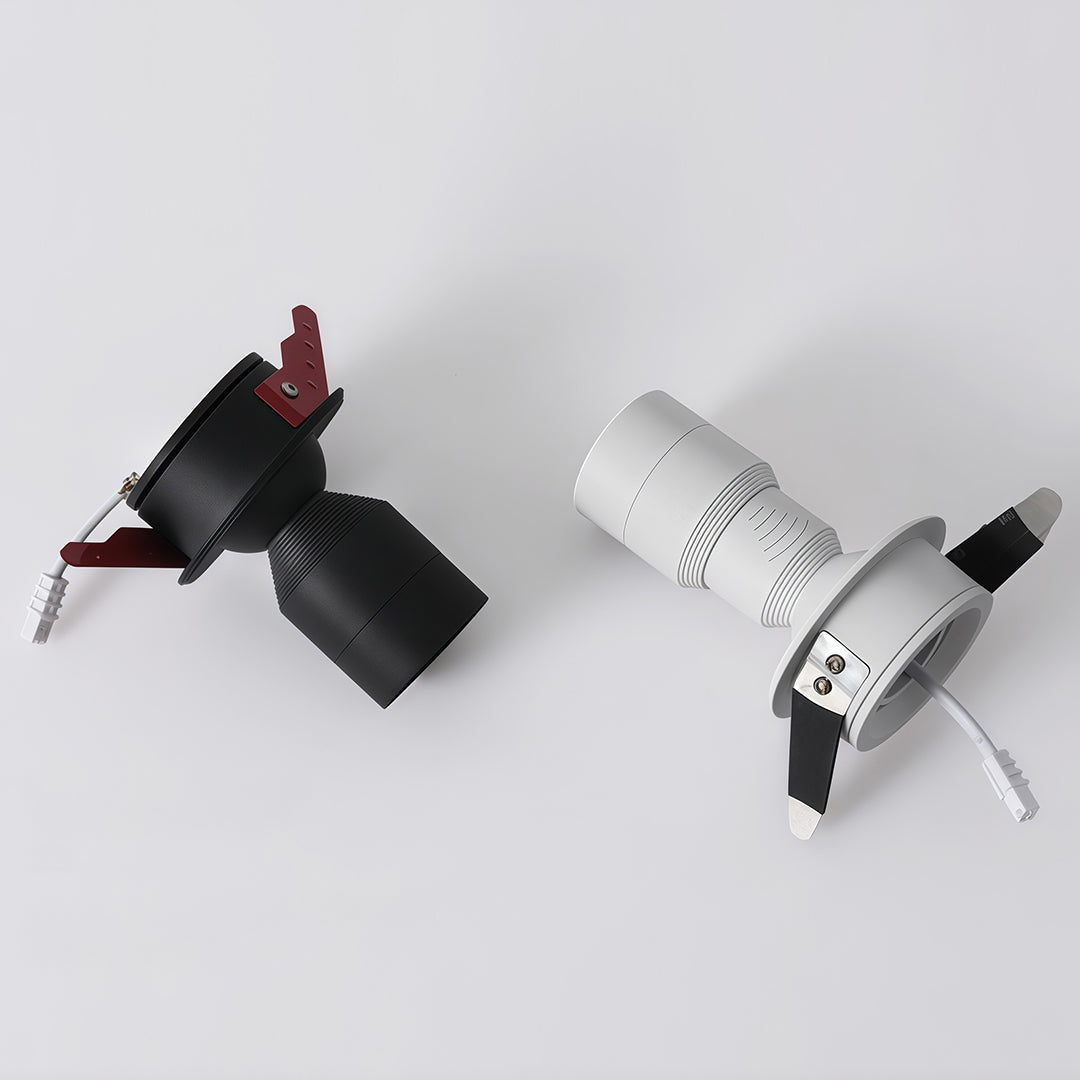 Slim adjustable LED downlight with ribbed design, providing efficient and stylish lighting solutions for minimalist interiors.